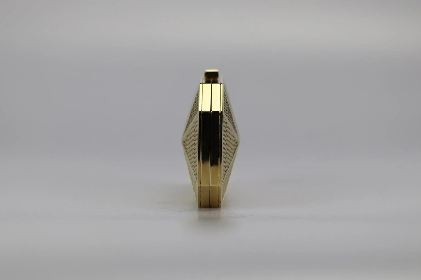 STARK EMBOSSED GOLD TONE CLUTCH - Image 5